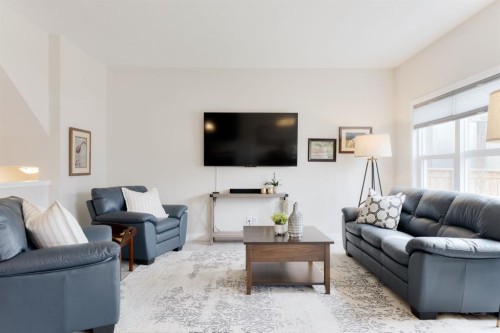218 Riviera View, Cochrane, AB - Indoor Photo Showing Living Room
