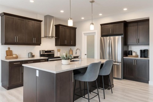 218 Riviera View, Cochrane, AB - Indoor Photo Showing Kitchen With Stainless Steel Kitchen With Upgraded Kitchen