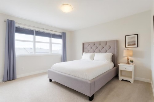 218 Riviera View, Cochrane, AB - Indoor Photo Showing Bedroom