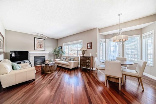 232 Coral Keys Place Ne, Calgary, AB - Indoor Photo Showing Living Room With Fireplace