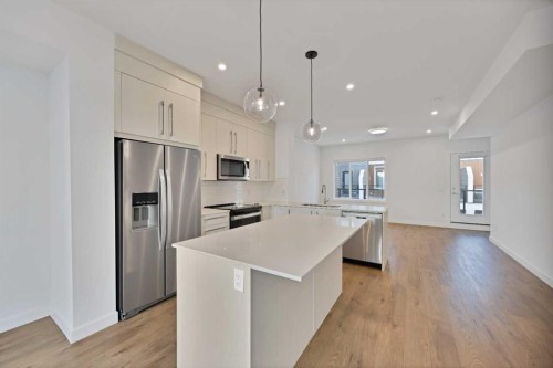 1403-280 Chelsea Road, Chestermere, AB - Indoor Photo Showing Kitchen With Stainless Steel Kitchen With Upgraded Kitchen
