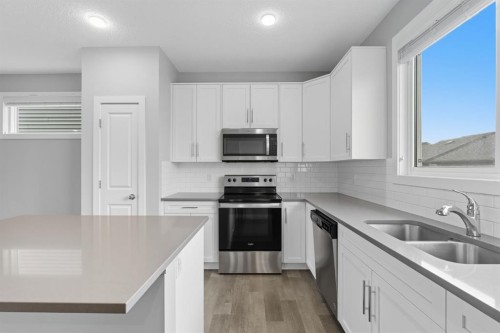 167 Highview Gate Se, Airdrie, AB - Indoor Photo Showing Kitchen With Stainless Steel Kitchen With Double Sink