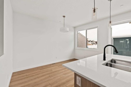 15 Herron Walk Ne, Calgary, AB - Indoor Photo Showing Kitchen With Double Sink