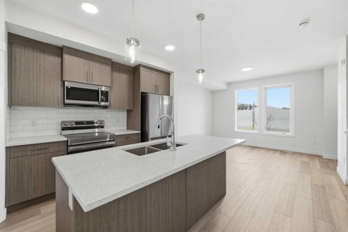 1923 Mccaskill Drive, Crossfield, AB - Indoor Photo Showing Kitchen With Double Sink With Upgraded Kitchen