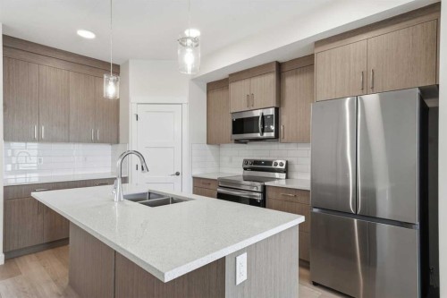 1923 Mccaskill Drive, Crossfield, AB - Indoor Photo Showing Kitchen With Double Sink With Upgraded Kitchen