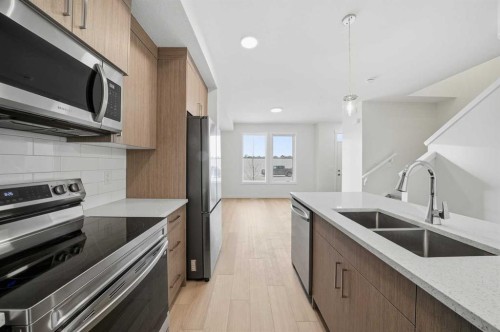 1923 Mccaskill Drive, Crossfield, AB - Indoor Photo Showing Kitchen With Double Sink With Upgraded Kitchen