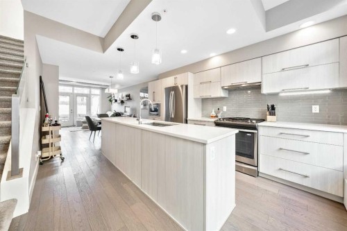 308-1611 28 Avenue Sw, Calgary, AB - Indoor Photo Showing Kitchen With Stainless Steel Kitchen With Upgraded Kitchen