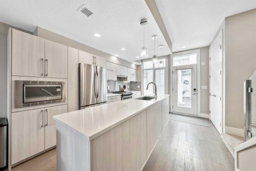 308-1611 28 Avenue Sw, Calgary, AB - Indoor Photo Showing Kitchen With Stainless Steel Kitchen With Upgraded Kitchen