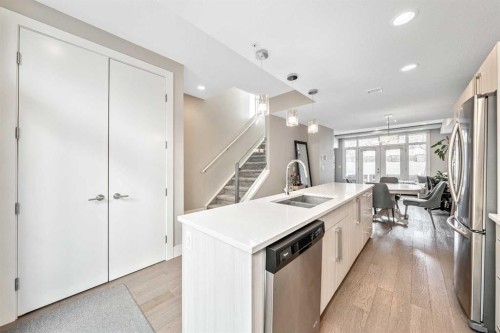 308-1611 28 Avenue Sw, Calgary, AB - Indoor Photo Showing Kitchen With Stainless Steel Kitchen With Double Sink With Upgraded Kitchen