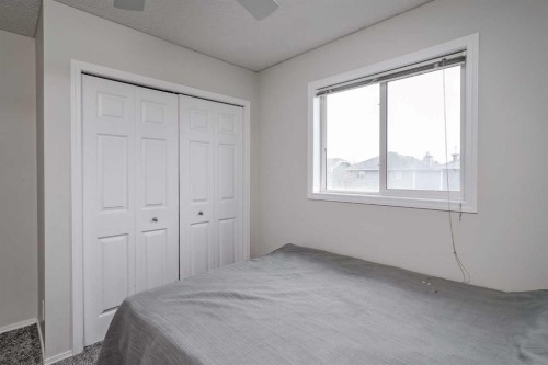 222 Bridleridge Way Sw, Calgary, AB - Indoor Photo Showing Bedroom