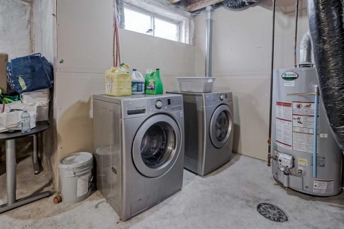 222 Bridleridge Way Sw, Calgary, AB - Indoor Photo Showing Laundry Room