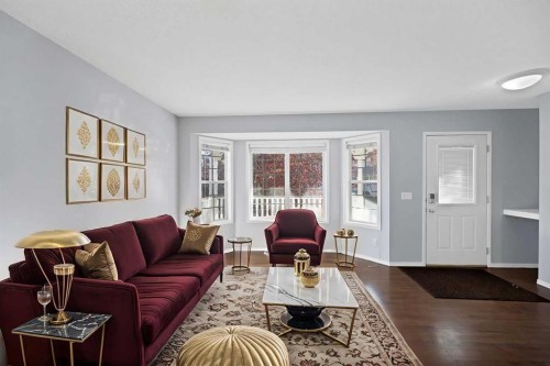 73 Hidden Spring Green Nw, Calgary, AB - Indoor Photo Showing Living Room