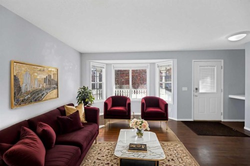 73 Hidden Spring Green Nw, Calgary, AB - Indoor Photo Showing Living Room