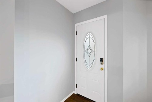 73 Hidden Spring Green Nw, Calgary, AB - Indoor Photo Showing Other Room