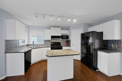 73 Hidden Spring Green Nw, Calgary, AB - Indoor Photo Showing Kitchen