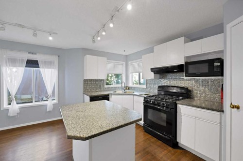 73 Hidden Spring Green Nw, Calgary, AB - Indoor Photo Showing Kitchen
