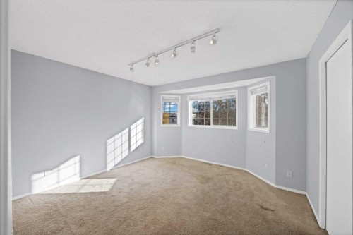 73 Hidden Spring Green Nw, Calgary, AB - Indoor Photo Showing Other Room