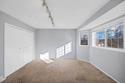 73 Hidden Spring Green Nw, Calgary, AB - Indoor Photo Showing Other Room