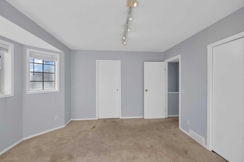 73 Hidden Spring Green Nw, Calgary, AB - Indoor Photo Showing Other Room