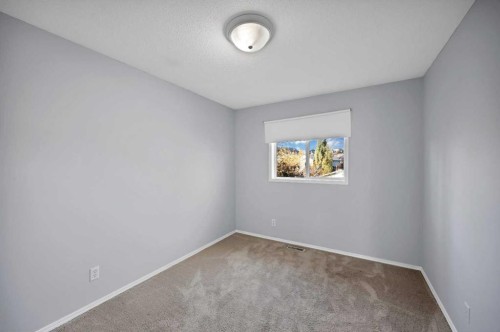 73 Hidden Spring Green Nw, Calgary, AB - Indoor Photo Showing Other Room