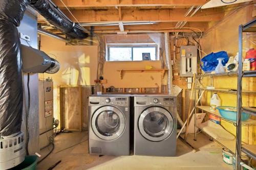 73 Hidden Spring Green Nw, Calgary, AB - Indoor Photo Showing Laundry Room