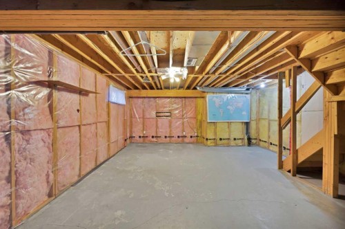 73 Hidden Spring Green Nw, Calgary, AB - Indoor Photo Showing Basement