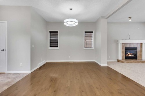 58 Nolanfield Heights Nw, Calgary, AB - Indoor Photo Showing Other Room With Fireplace