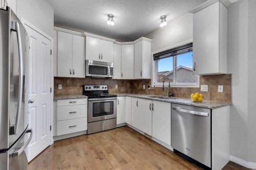 58 Nolanfield Heights Nw, Calgary, AB - Indoor Photo Showing Kitchen With Upgraded Kitchen