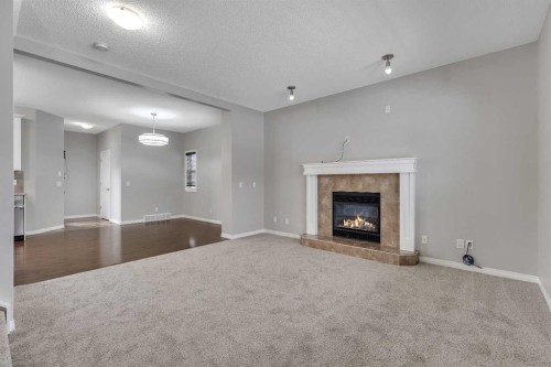 58 Nolanfield Heights Nw, Calgary, AB - Indoor Photo Showing Living Room With Fireplace