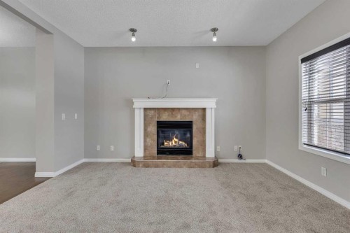 58 Nolanfield Heights Nw, Calgary, AB - Indoor Photo Showing Living Room With Fireplace