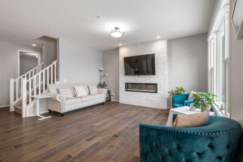 1464 Livingston Way Ne, Calgary, AB - Indoor Photo Showing Living Room With Fireplace