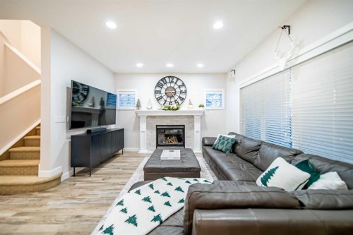 42 Copperfield Point Se, Calgary, AB - Indoor Photo Showing Living Room With Fireplace