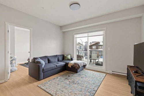 2201-33 Carringham Gate Nw, Calgary, AB - Indoor Photo Showing Living Room