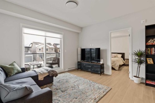 2201-33 Carringham Gate Nw, Calgary, AB - Indoor Photo Showing Living Room