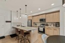 2201-33 Carringham Gate Nw, Calgary, AB  - Indoor Photo Showing Kitchen With Stainless Steel Kitchen With Upgraded Kitchen 