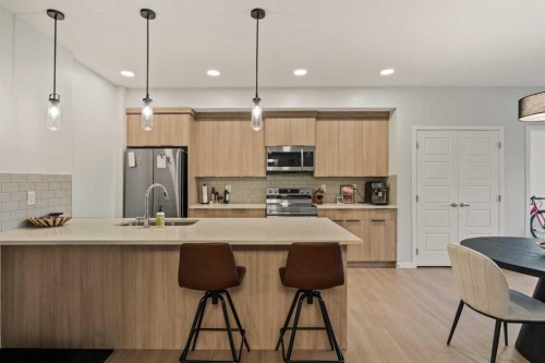 2201-33 Carringham Gate Nw, Calgary, AB - Indoor Photo Showing Kitchen With Stainless Steel Kitchen With Upgraded Kitchen