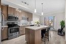 201-15233 1 Street Se, Calgary, AB  - Indoor Photo Showing Kitchen With Stainless Steel Kitchen With Upgraded Kitchen 