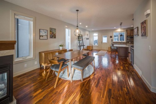 820 19 Avenue Nw, Calgary, AB - Indoor Photo Showing Dining Room With Fireplace