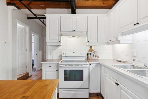 316-220 11 Avenue Se, Calgary, AB - Indoor Photo Showing Kitchen With Double Sink