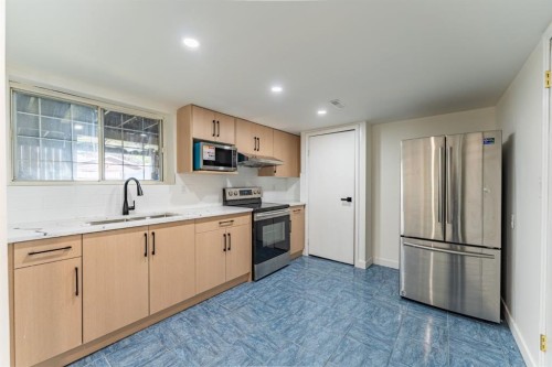 344 Templeview Drive Ne, Calgary, AB - Indoor Photo Showing Kitchen With Stainless Steel Kitchen With Double Sink