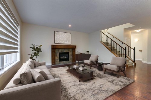 186 Copperfield Close Se, Calgary, AB - Indoor Photo Showing Living Room With Fireplace