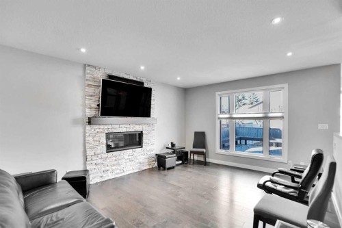 33 Douglasbank Rise Se, Calgary, AB - Indoor Photo Showing Living Room With Fireplace