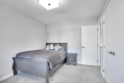 33 Douglasbank Rise Se, Calgary, AB - Indoor Photo Showing Bedroom