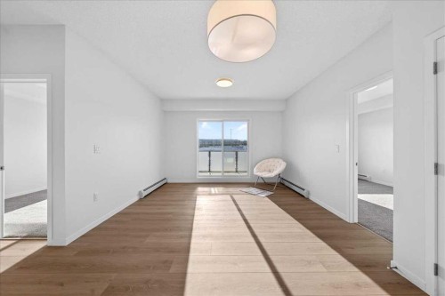 325-245 Edith Place Nw, Calgary, AB - Indoor Photo Showing Other Room