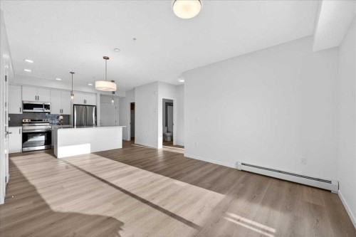 325-245 Edith Place Nw, Calgary, AB - Indoor Photo Showing Kitchen