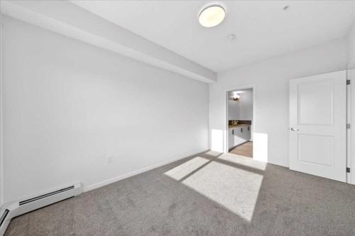 325-245 Edith Place Nw, Calgary, AB - Indoor Photo Showing Other Room