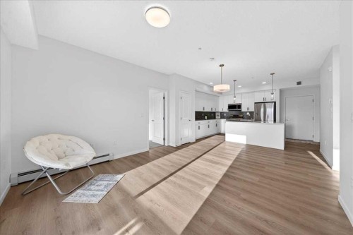 325-245 Edith Place Nw, Calgary, AB - Indoor Photo Showing Other Room