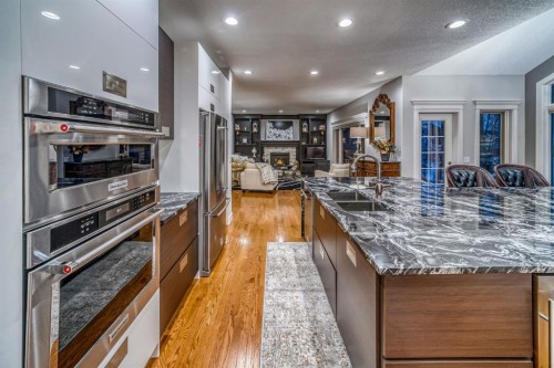 158 Gleneagles View, Cochrane, AB - Indoor Photo Showing Kitchen With Double Sink With Upgraded Kitchen
