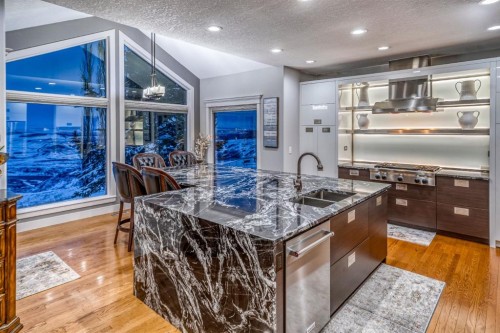 158 Gleneagles View, Cochrane, AB - Indoor Photo Showing Kitchen With Double Sink With Upgraded Kitchen