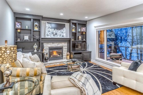 158 Gleneagles View, Cochrane, AB - Indoor Photo Showing Living Room With Fireplace